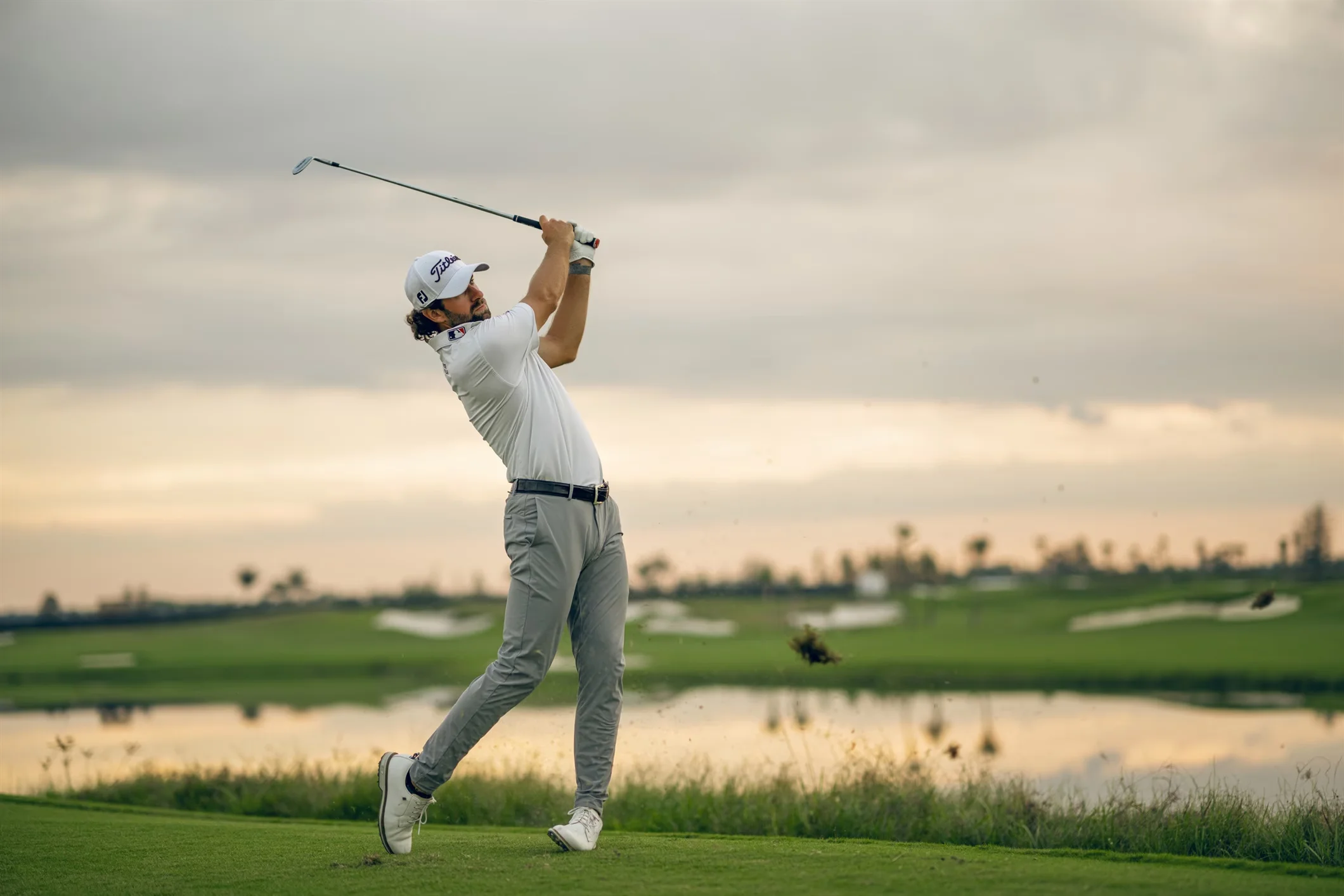 A professional golfer takes a swing at the PGA championship.